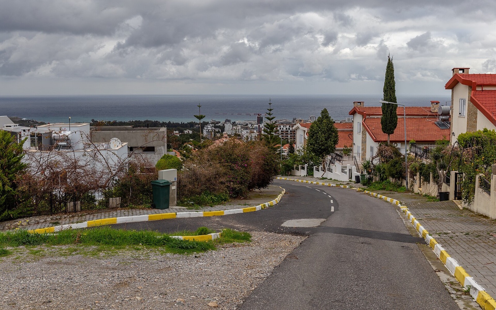 A residential hillside street above Kyrenia with the sea beyond